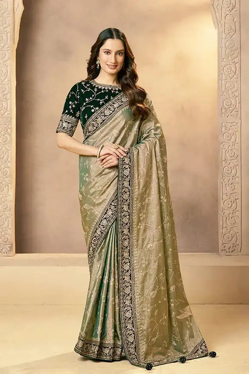 Emerald green and gold kora zari tissue silk saree with ornate zardozi border