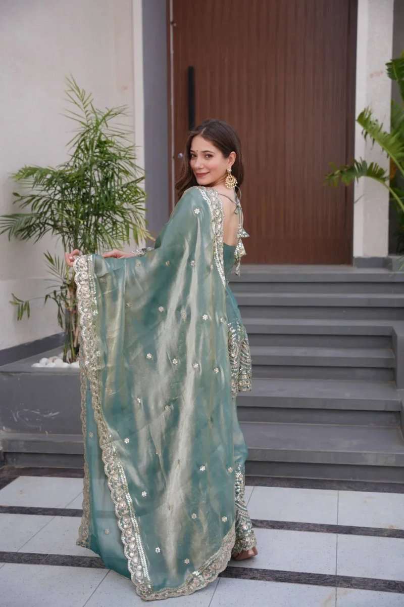 Teal satin sharara suit with gold mirror embroidery, flared hem and long dupatta