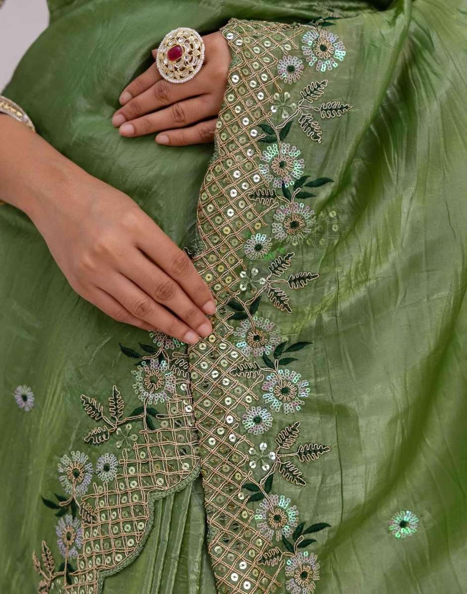 Green saree fabric with gold-toned floral and lattice embroidery
