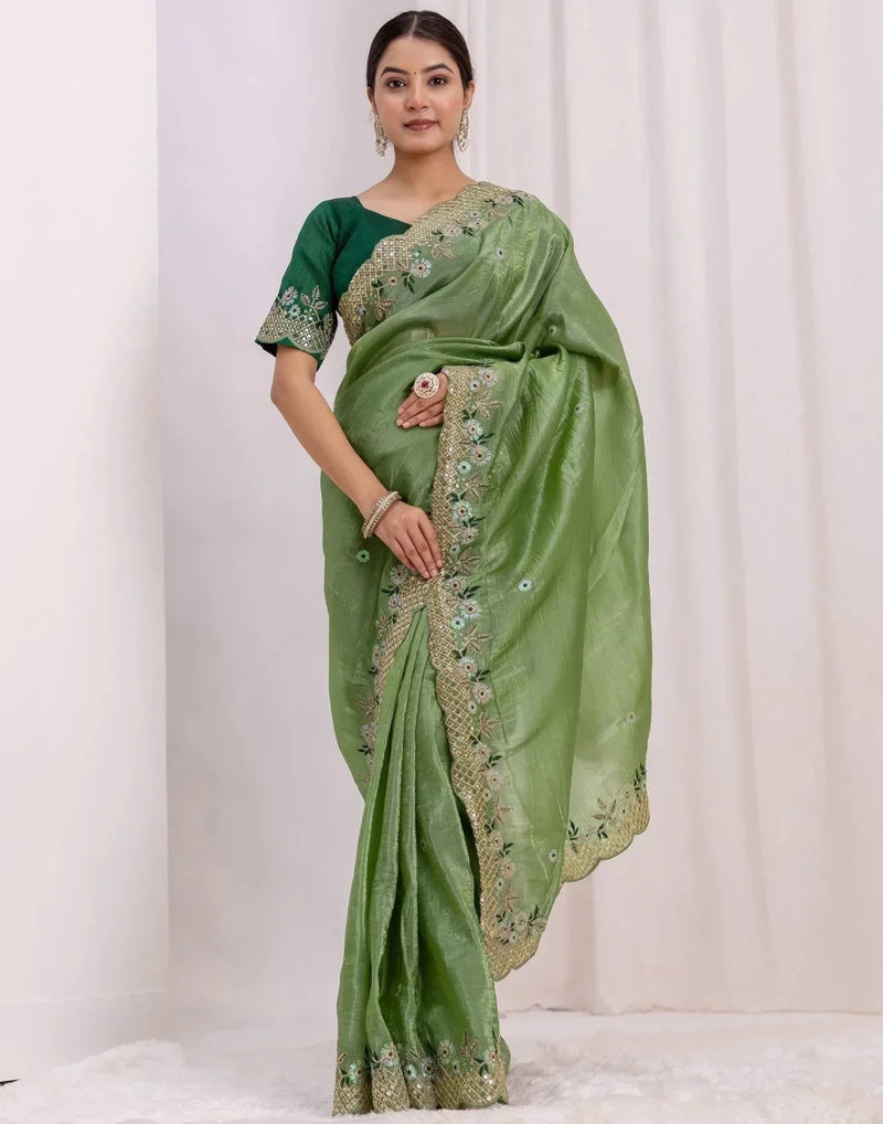 Green saree with gold-toned embroidered border and pallu detail