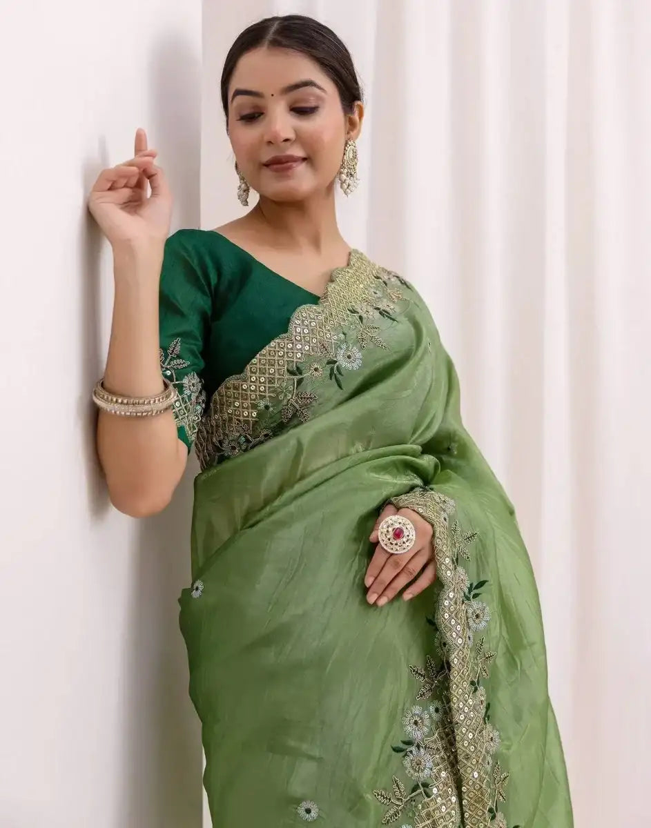 Green saree with gold-toned embroidered shoulder and pallu