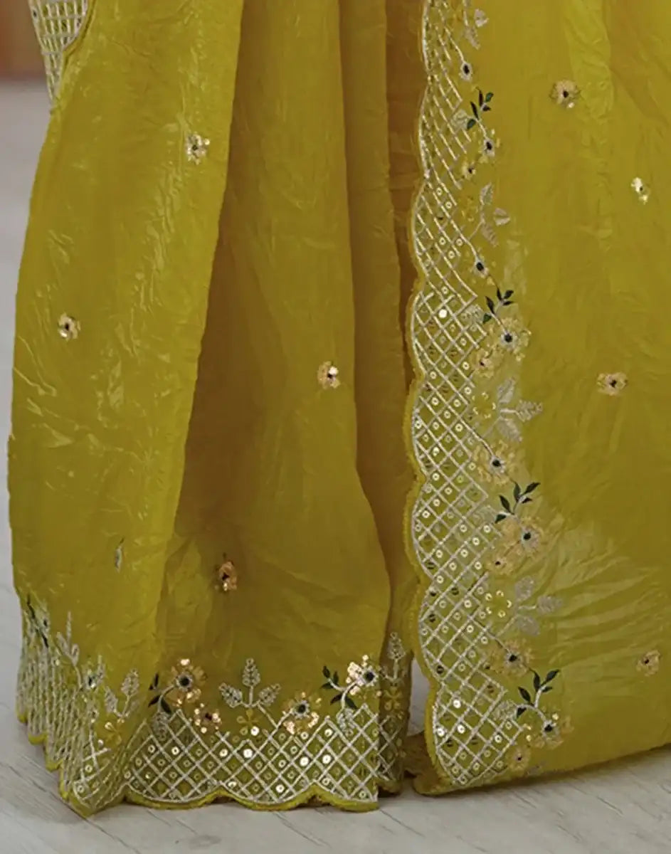 Yellow saree with gold checkered border panel and floral sequin embroidery