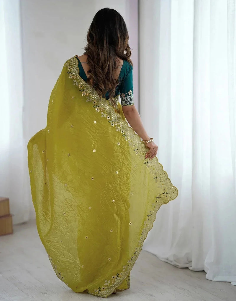 Yellow satin saree with gold embroidered motifs, back drape view