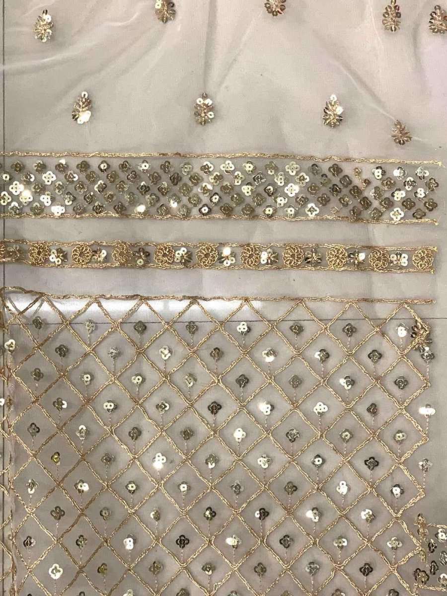 Gold and ivory sequin border with diamond pattern on net saree fabric