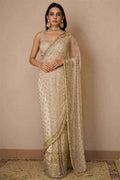 Nayoora ivory and gold net saree with sequin butta motifs and gold border drape