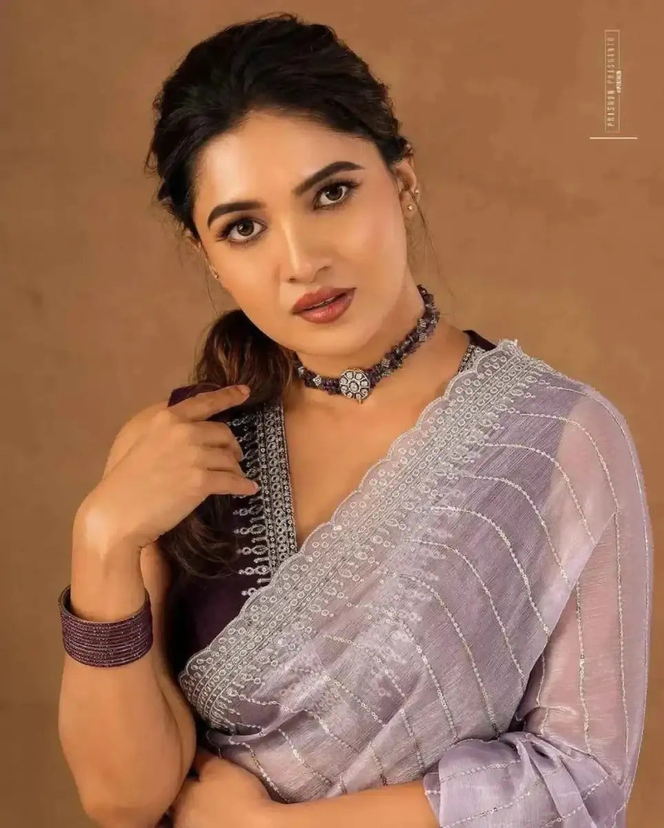 Lavender saree with sequin and zari trim on the pallu, side drape detail