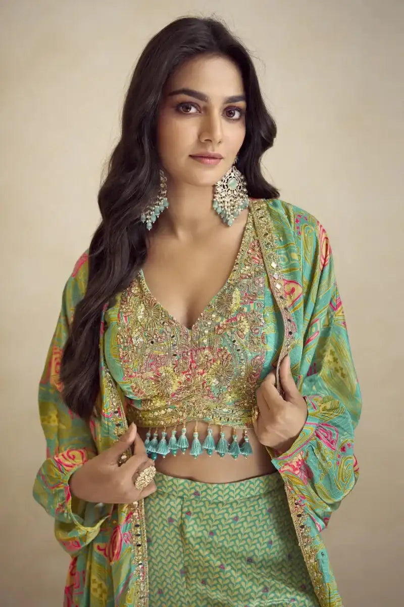 Teal mirror-work bustier with embellished neckline and printed flowing cape