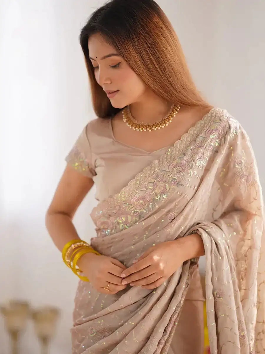 Champagne beige saree blouse with sequin motifs and draped pallu detail