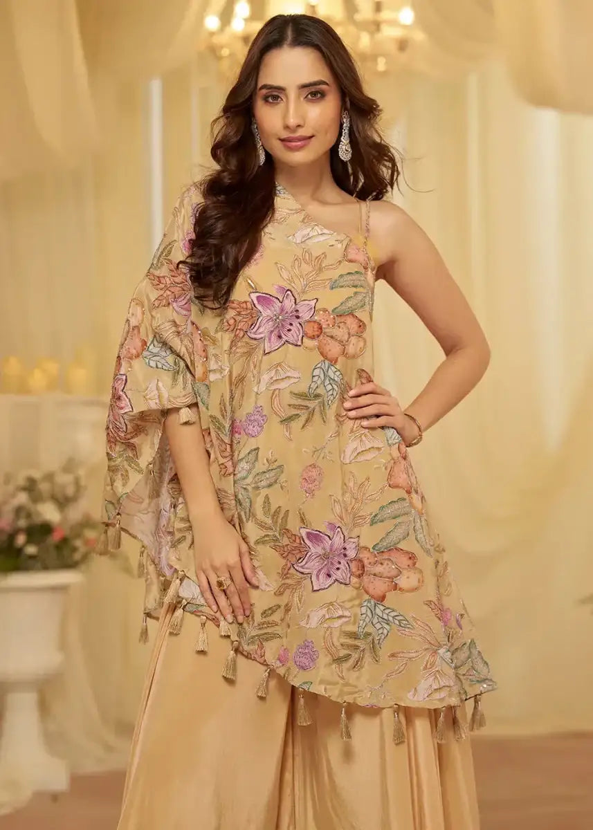 Floral asymmetric sleeveless cape top with tassel hem and champagne wide-leg pants