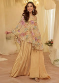Floral asymmetric cape top and champagne wide-leg pants set, tassel trim