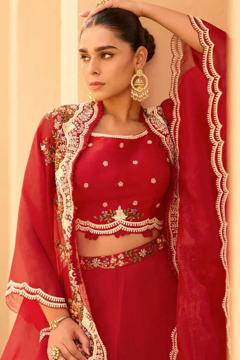 Cherry red embroidered cape with scalloped gold trim over matching top and palazzo