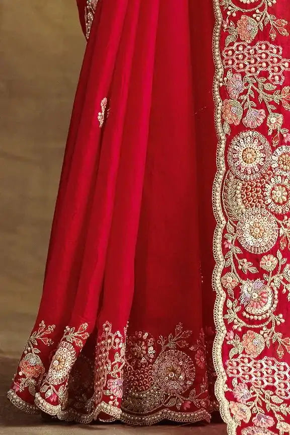Cherry red saree skirt with gold embroidered hem and draped pallu border
