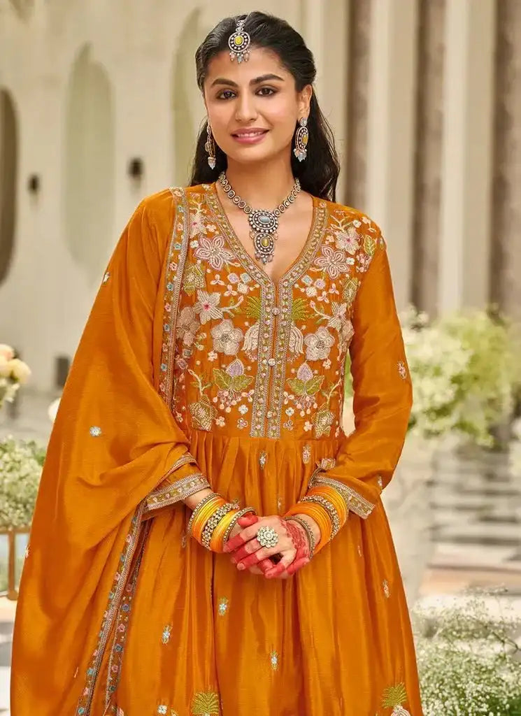 Rust orange embroidered tunic with floral motifs at neckline, long sleeves