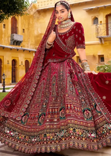 Maroon velvet bridal lehenga with ornate multi-thread embroidery and flared skirt