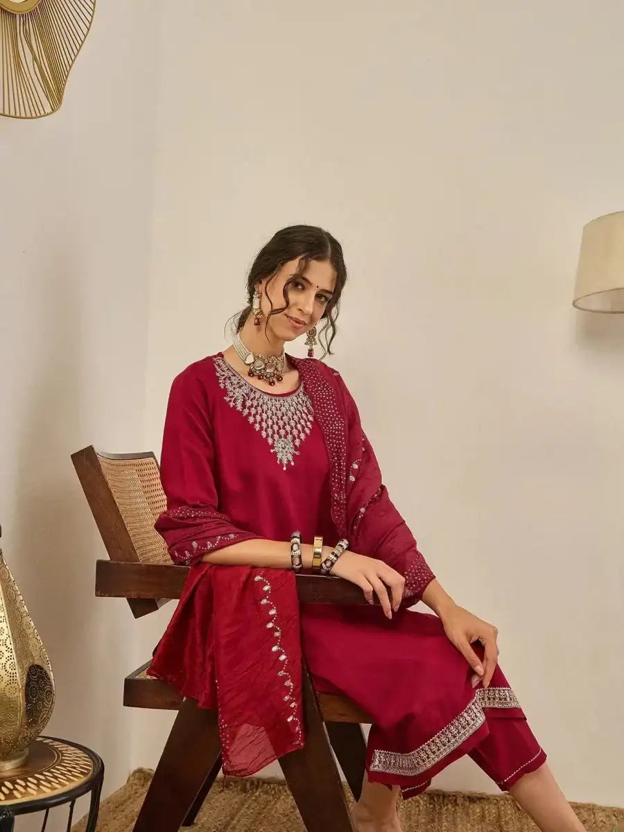 Deep maroon embroidered kurta with 3/4 sleeves and matching leggings; dupatta drape
