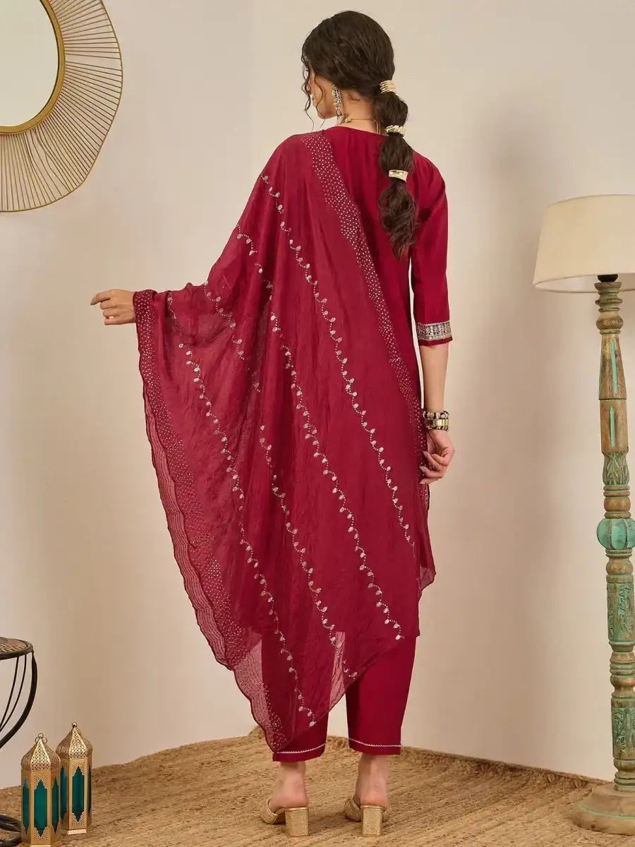 Back view deep maroon suit set with embellished dupatta over shoulder