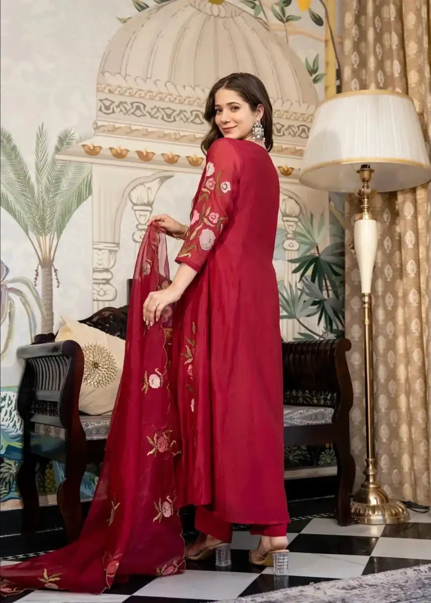 Muslin Anarkali suit set in dark ruby red with floral embroidery and long dupatta trail