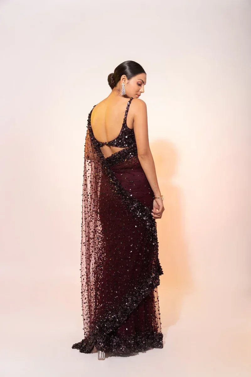 Deep wine sequin net cocktail saree, back view with open mesh back and draped fall