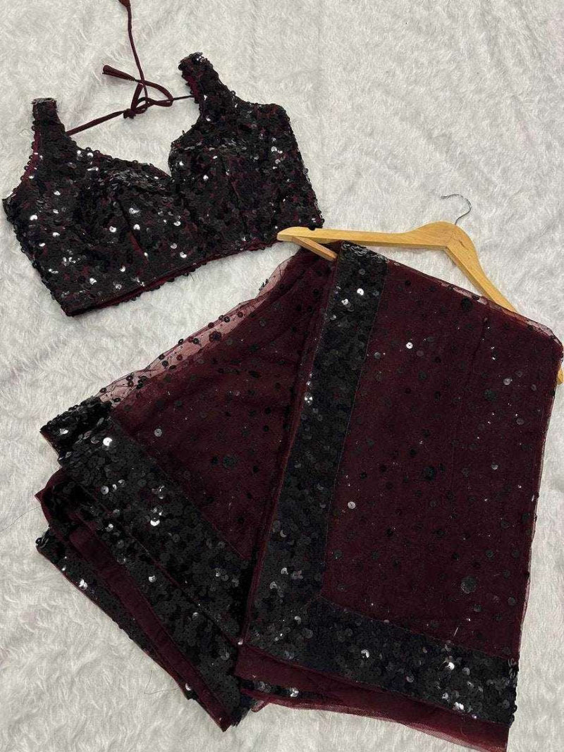 Deep wine sequin net cocktail saree top and skirt laid flat with hanger