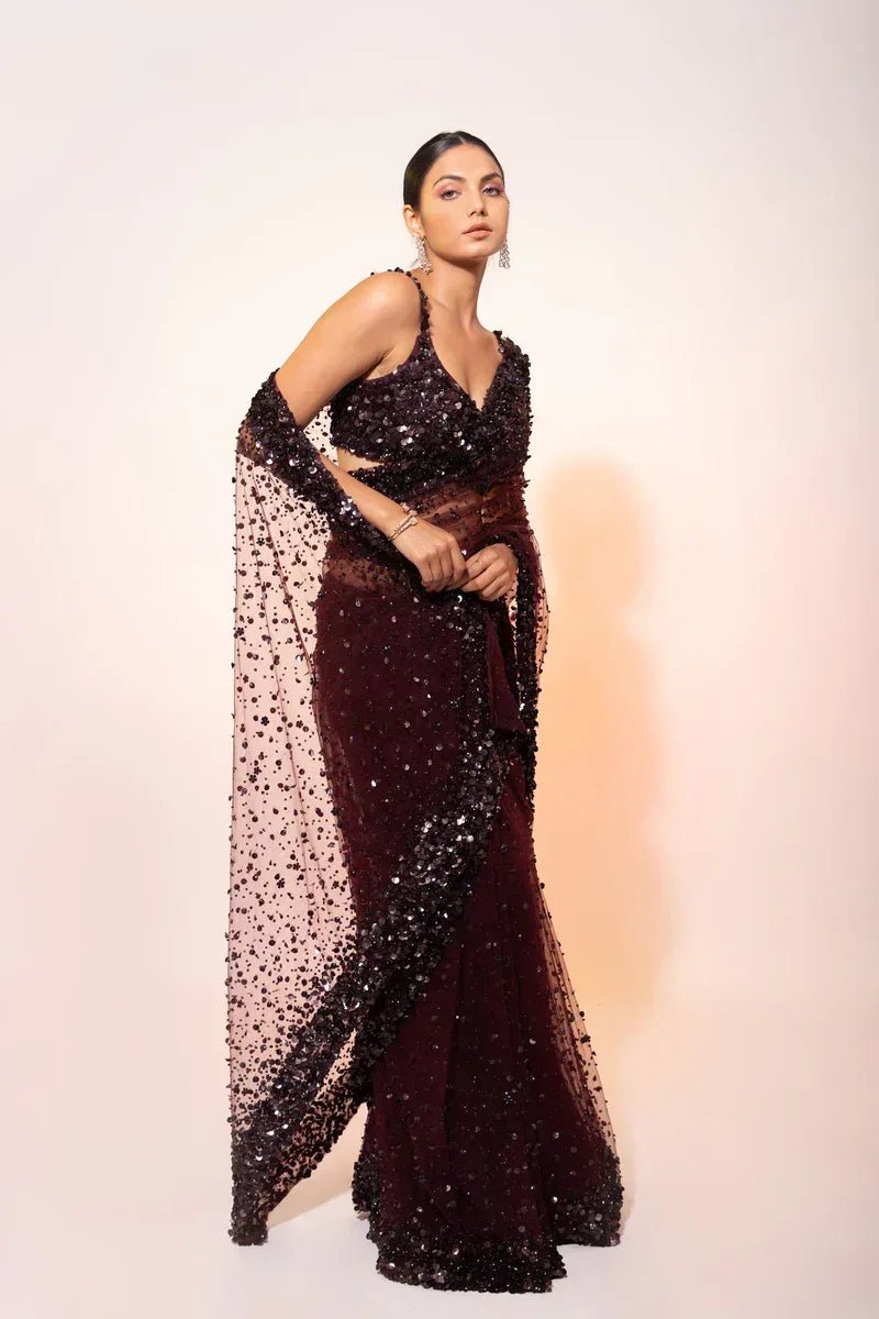 Deep wine sequin cocktail saree with long V-back straps and flowing net drape