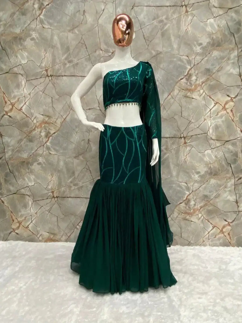Emerald green western lehenga set back view with embellished blouse and tiered skirt