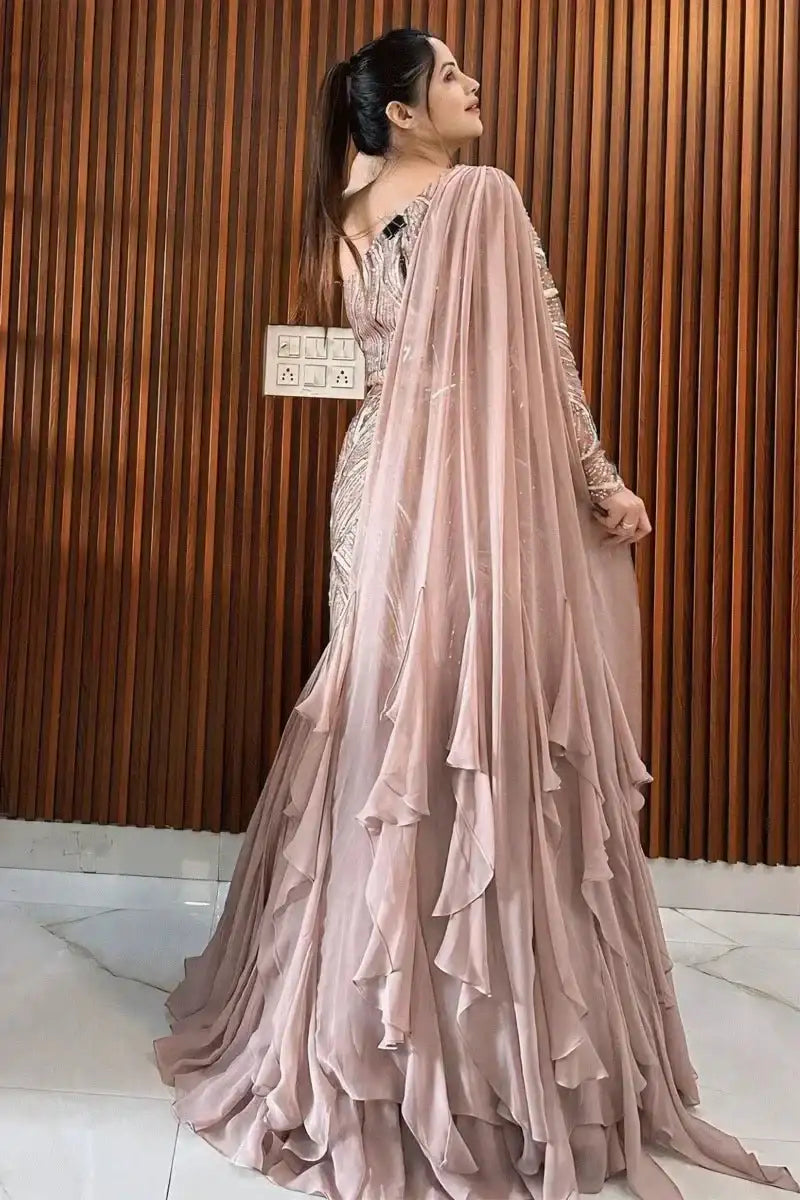 Blush rose lehenga set with embellished one-shoulder blouse and tiered skirt