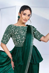 Peplum drape saree in dark green with floral embroidery and diagonal drape