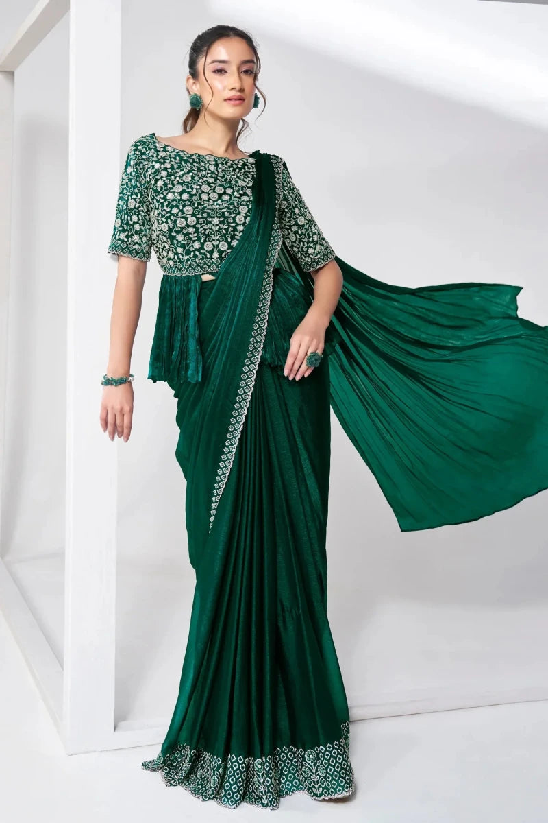 Dark green embroidered peplum drape saree with floral motif bodice and draped skirt