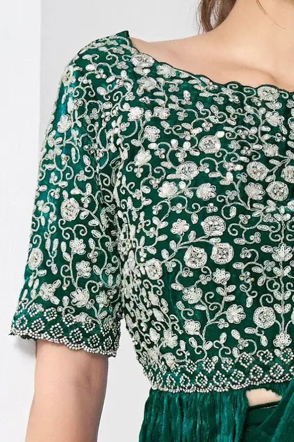 Dark green saree blouse with dense silver-toned floral embroidery and short sleeves