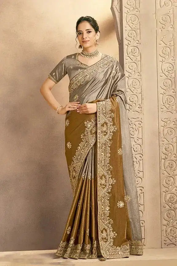 Grey-bronze silk saree with wide gold embroidery at hem and pallu