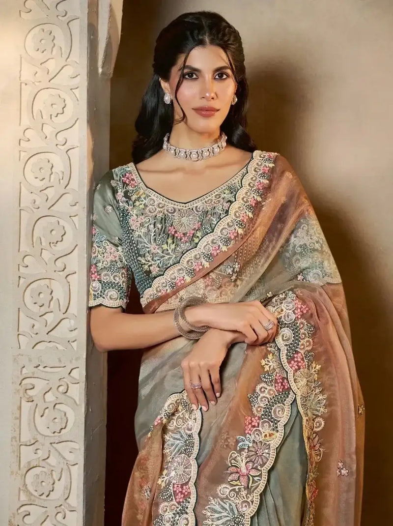Grey-teal tissue silk saree with multicolor floral embroidery and bronze scalloped border