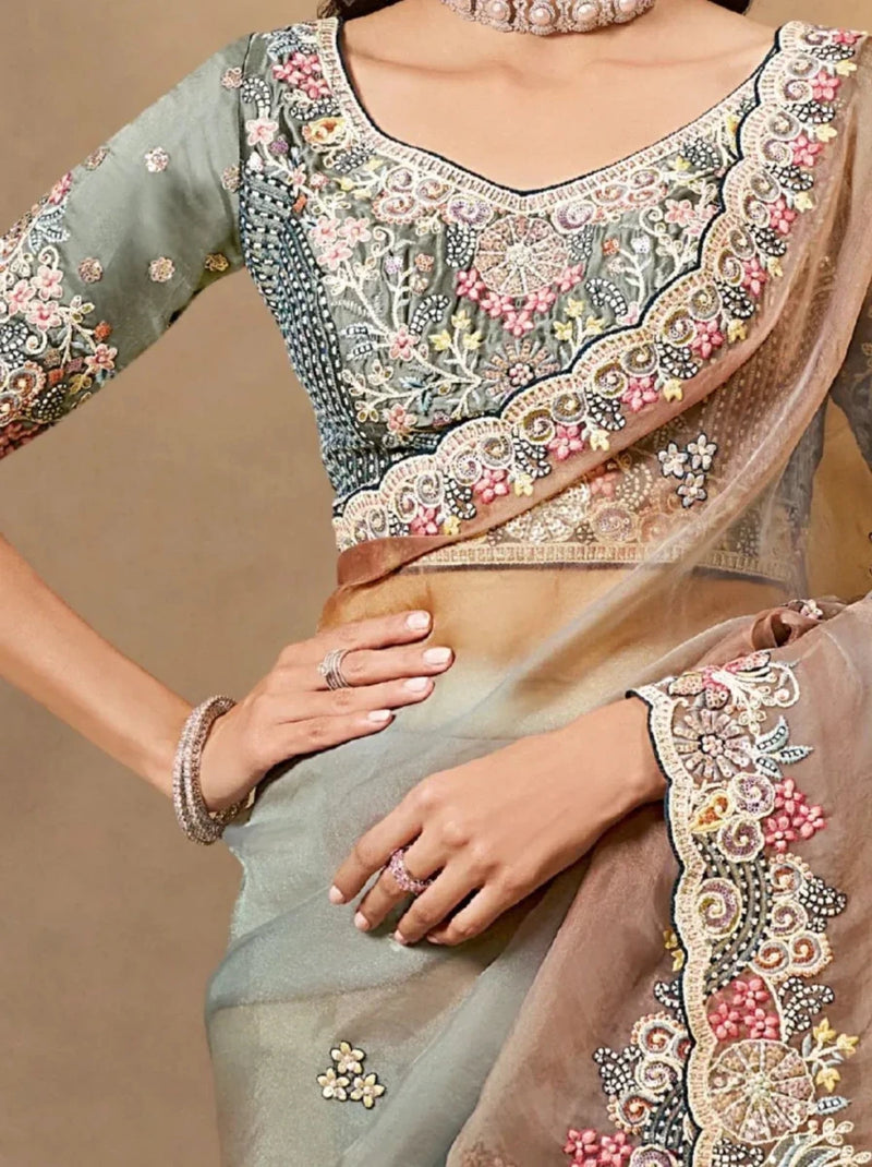 Grey-teal saree with ornate multicolor embroidery and bronze scalloped edge, close view