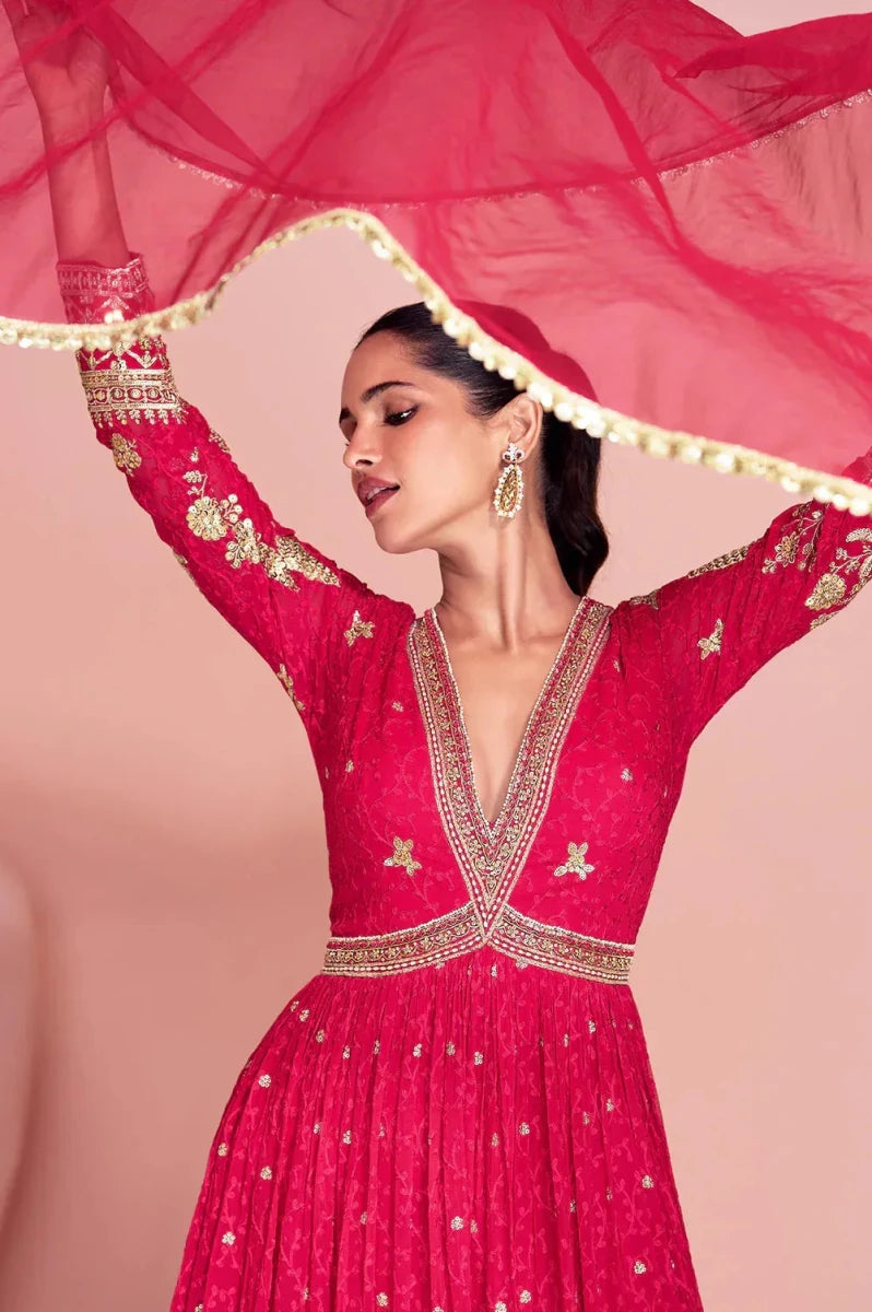 Hot pink embroidered anarkali gown with deep V-back and gold-trimmed neckline
