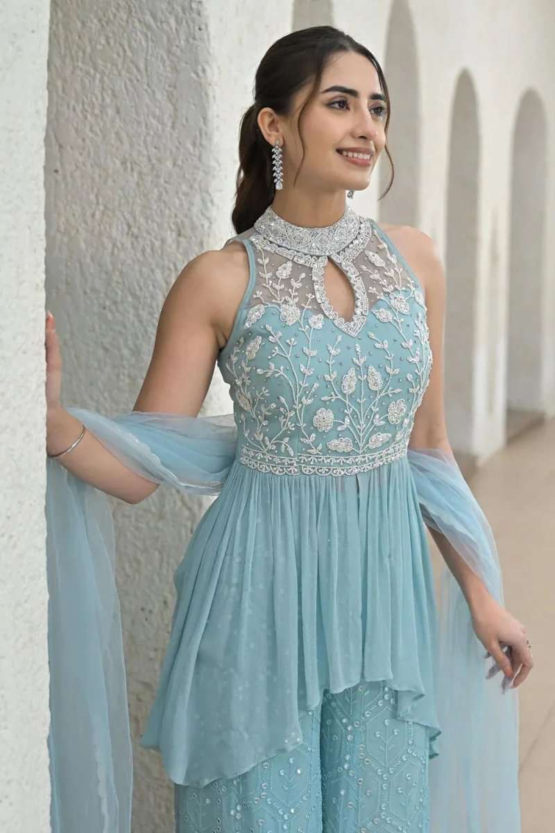 Icy powder blue sleeveless mirror-work top with keyhole neckline and peplum flounce