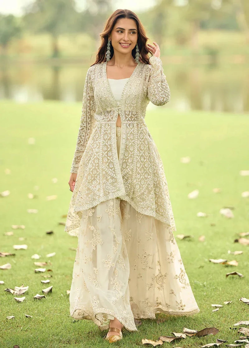 Ivory net jacket with bead embroidery over layered palazzo suit, full-length view