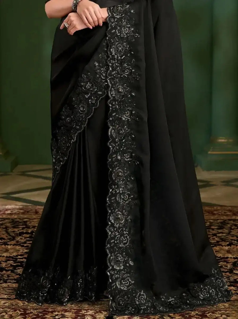 Black embroidered georgette silk saree with vertical decorative border on the skirt