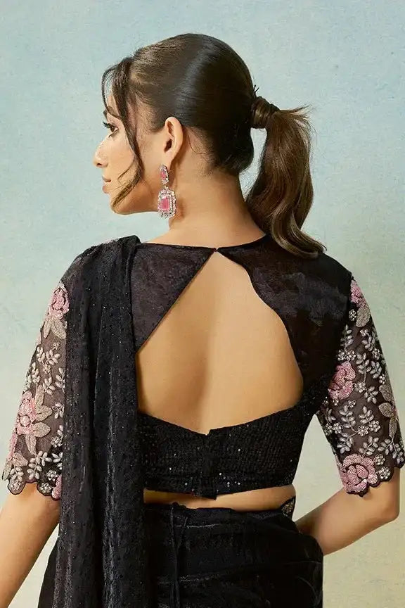 Back of jet black satin saree set with open back blouse and rose embroidery