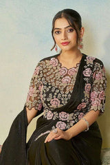 Black satin saree set with pink rose embroidery on blouse and draped sari