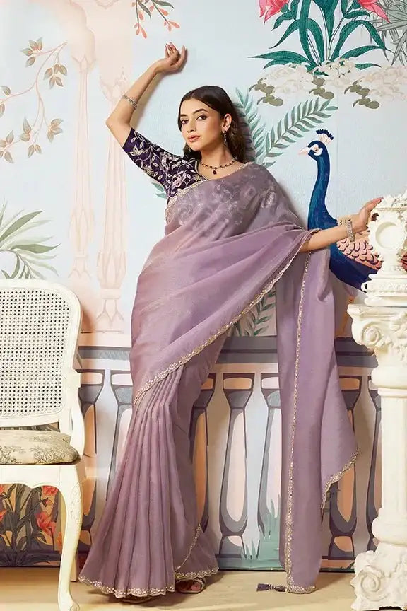 Lavender organza silk saree with gold zari border and dark embroidered blouse
