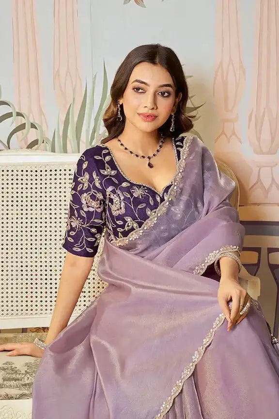 Lavender organza silk saree with gold trim and dark embroidered blouse front