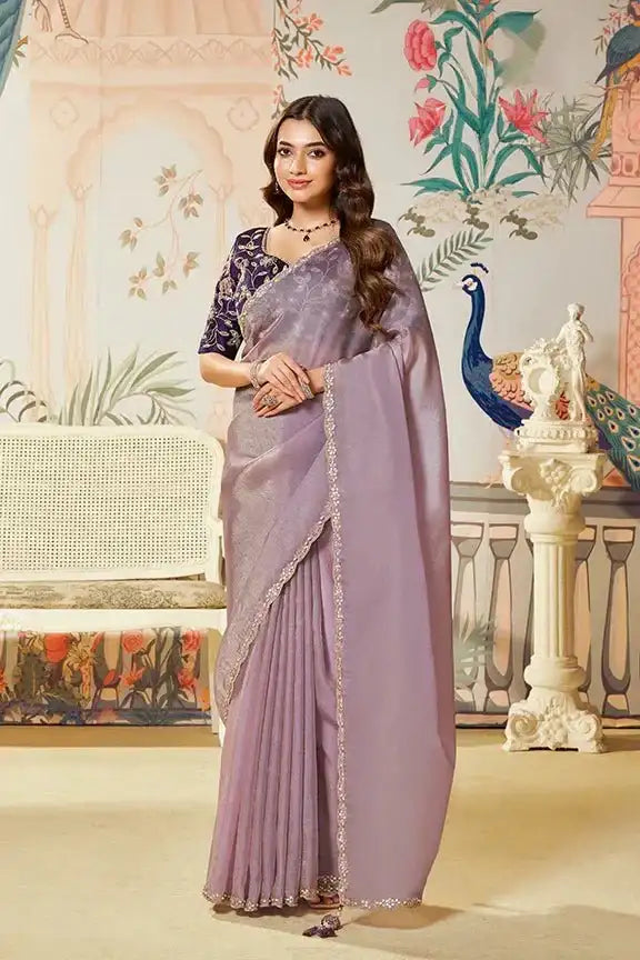 Lavender organza silk saree with gold zari border and embellished drape
