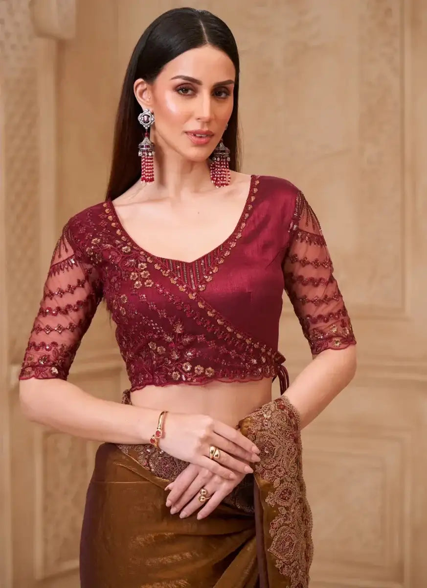 Burgundy blouse with V-neck and sheer lace sleeves, bronze satin saree drape