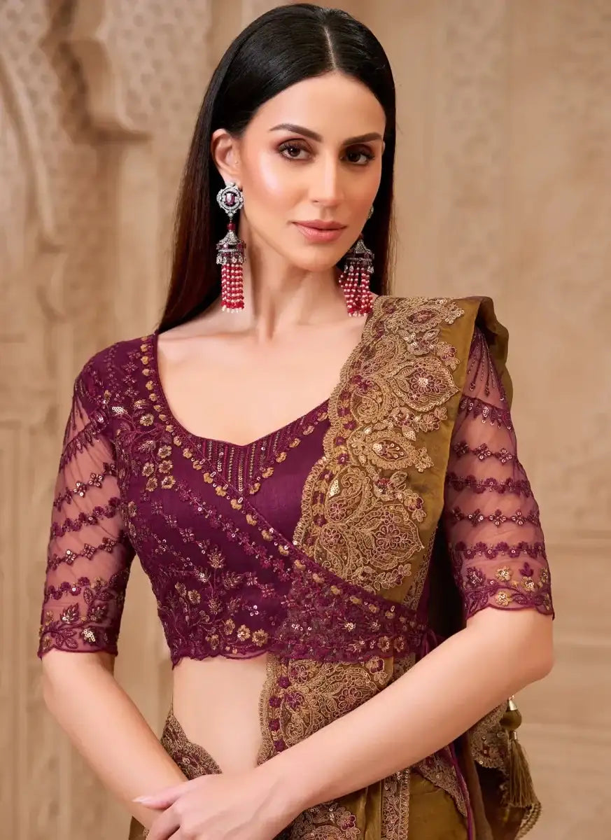 Wine blouse with sheer sleeves and gold floral border, paired with bronze saree