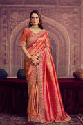 Metallic coral pink Kanjivaram silk saree with gold scalloped border and pallu drape