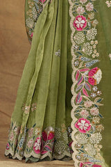 Green saree skirt with floral embroidered border and beadwork at the hem