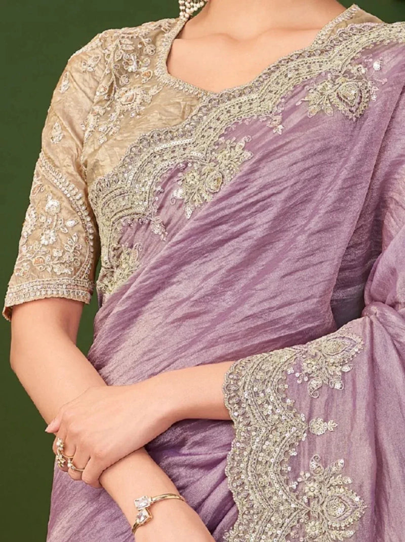 Close-up of lavender saree and gold embroidered blouse sleeve and neckline