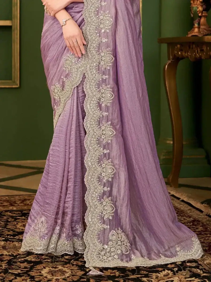 Lavender purple saree with ornate gold embroidery border; full drape view