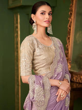 Lavender purple saree with gold embroidered blouse; draped pallu with ornate trim