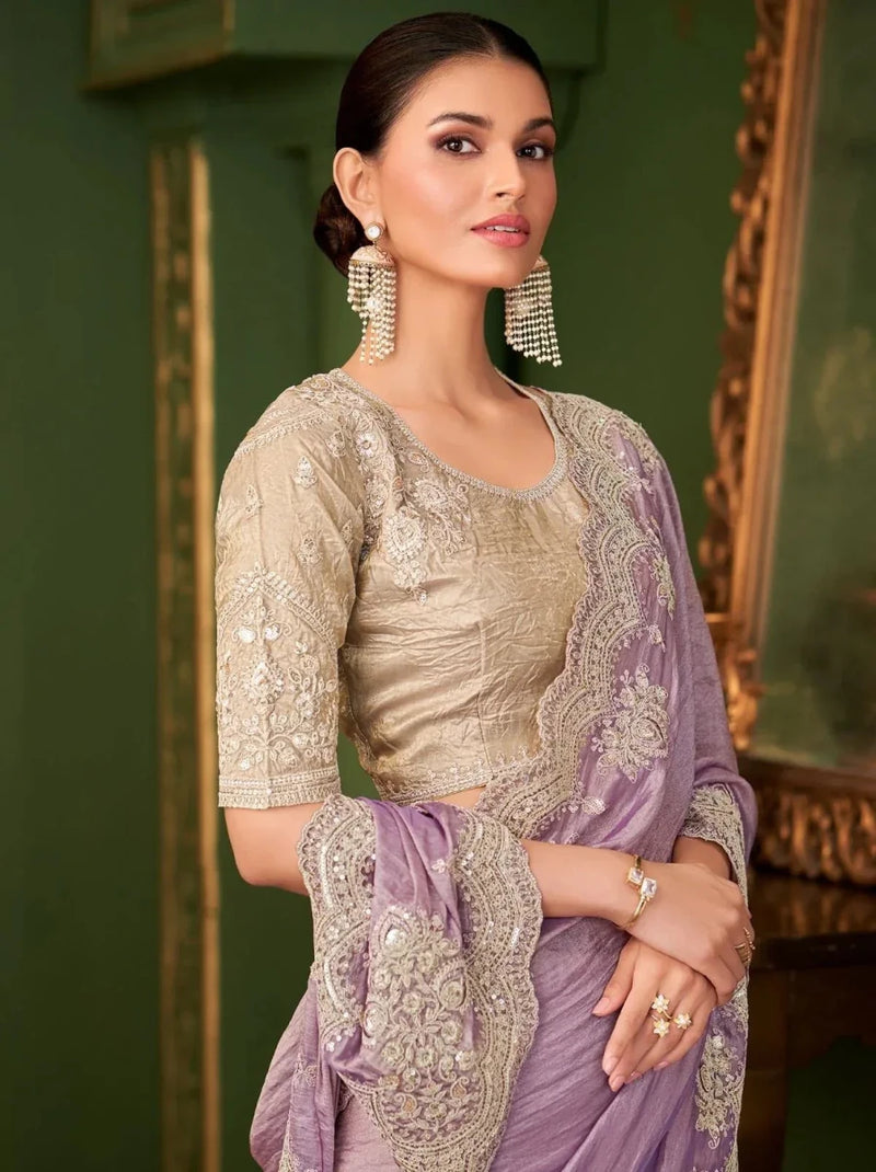 Lavender purple saree with gold embroidered blouse; draped pallu with ornate trim