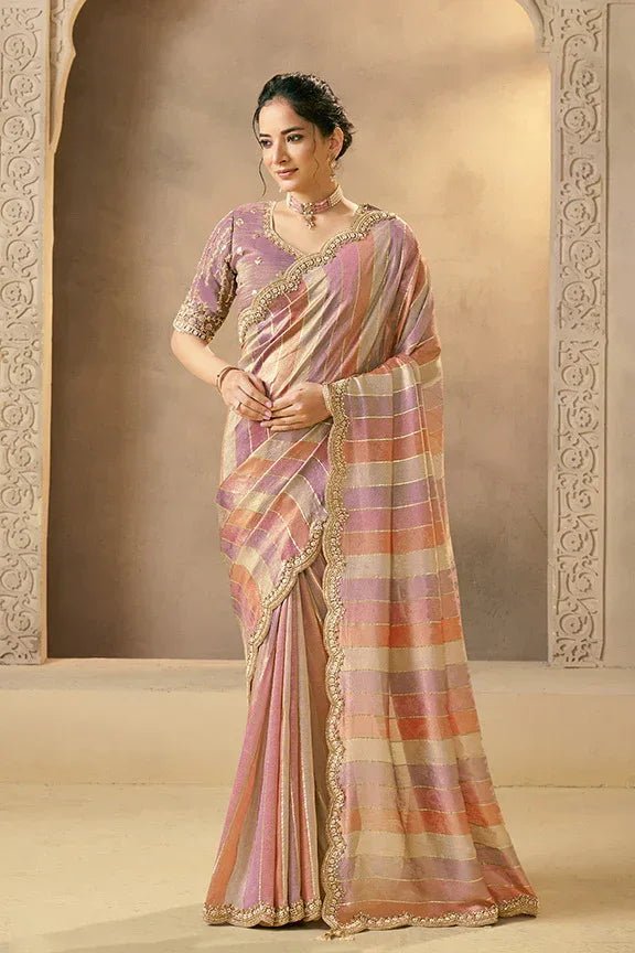 Pastel silk saree with metallic multi-stripe pallu and scalloped gold border